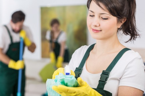 Domestic cleaner tidying a kitchen in Catford